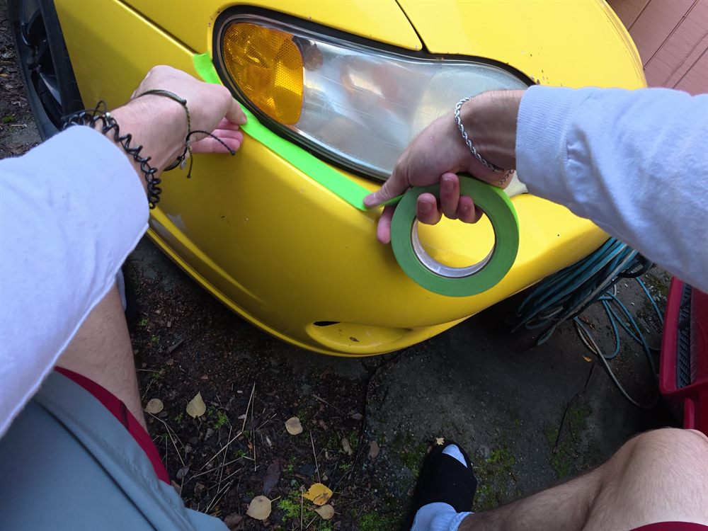 Taping off the paint around a headlight